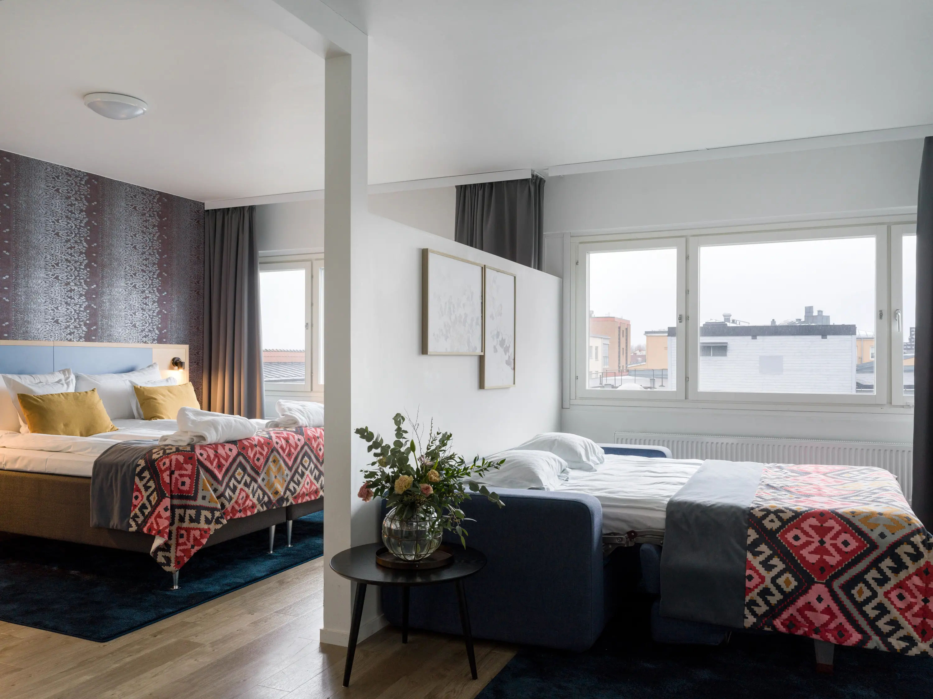Hotel room with double bed and sofa bed