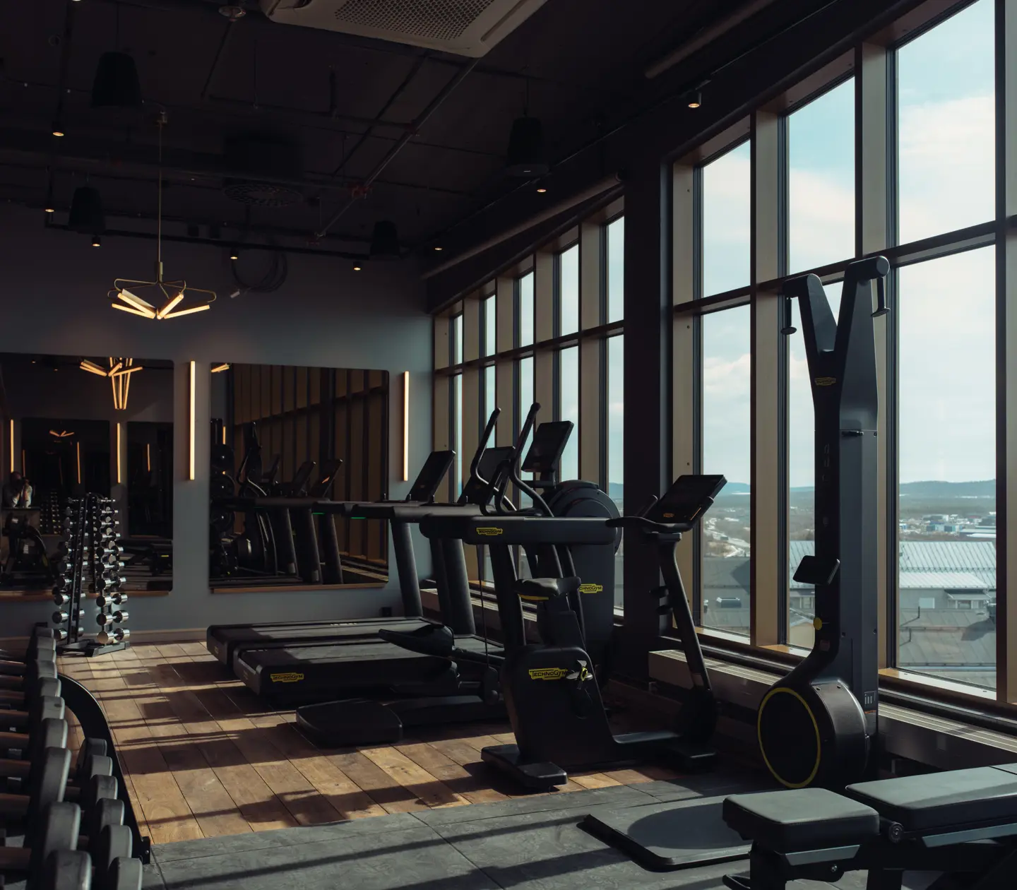 Wide view of the gym at Elite Hotel Frost featuring multiple workout machines.