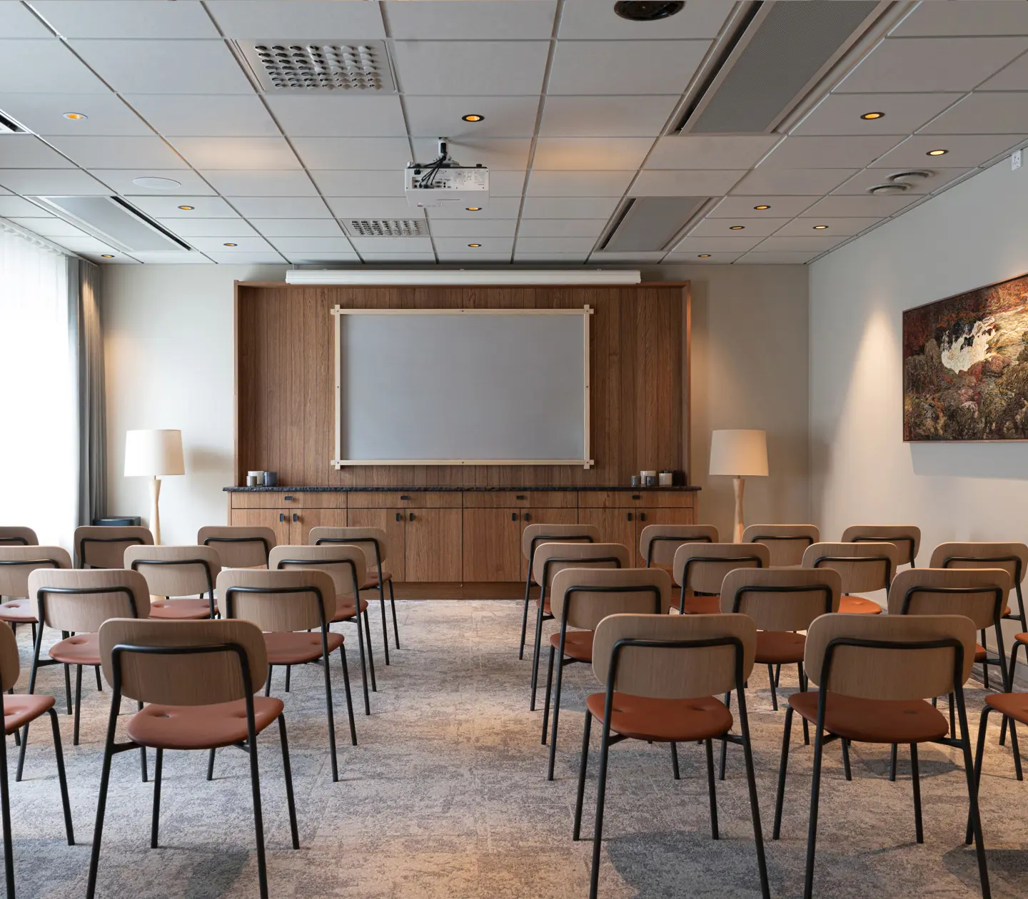 Conference facility with chairs in cinema seating