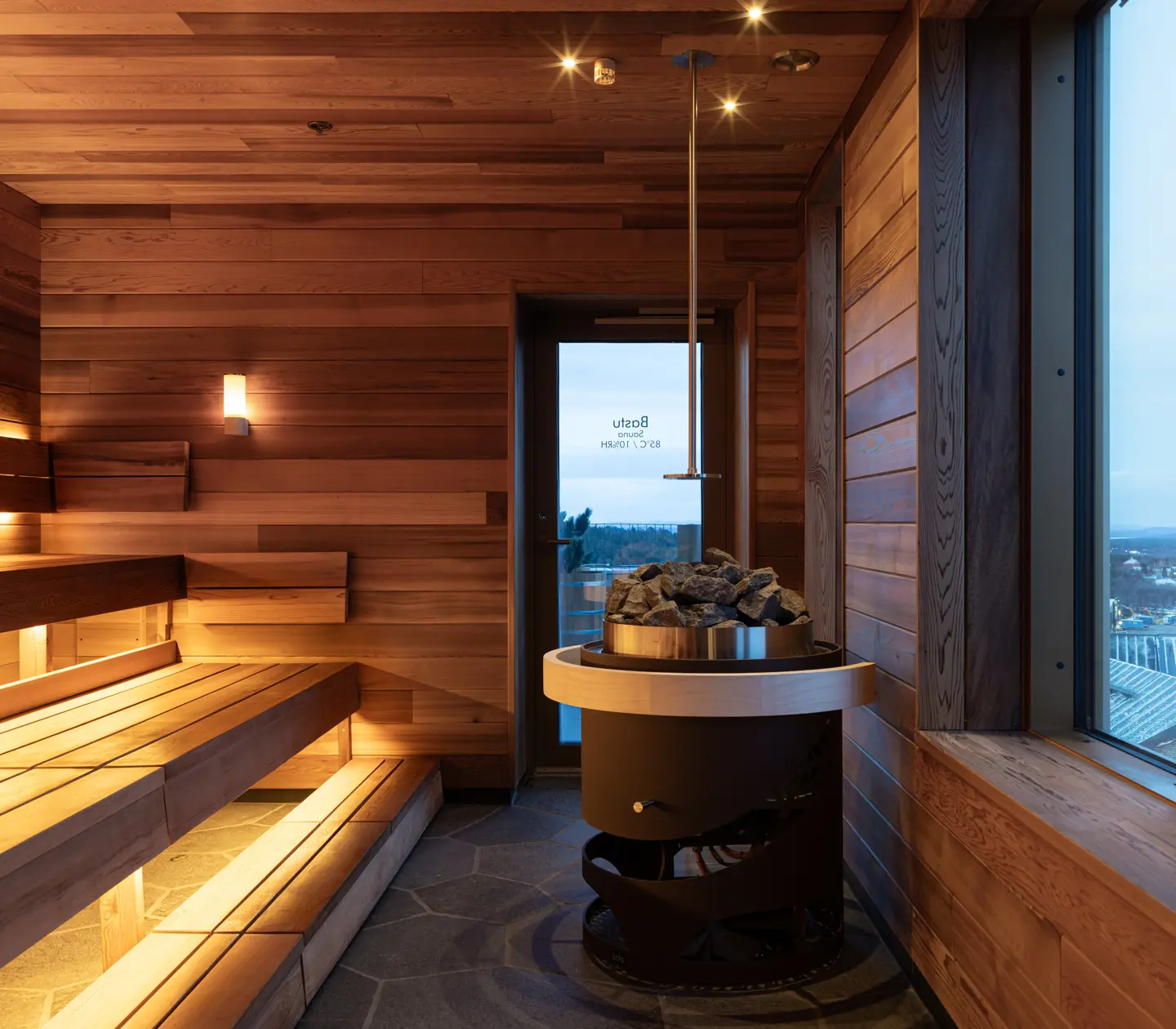 Pinewood sauna at Vana Spa with views of the mountains.