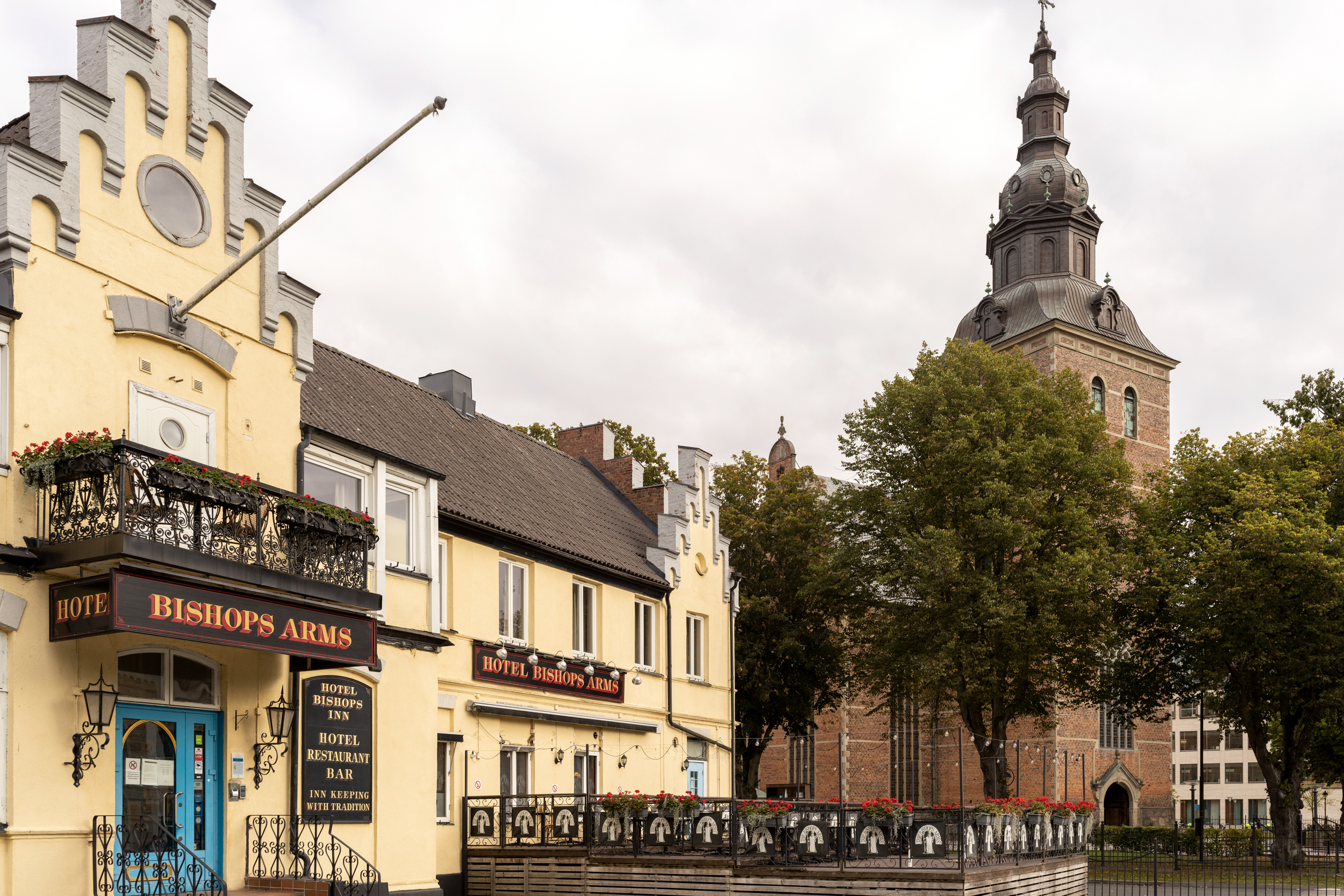 Yellow building with signs of Hotel Bishops Arms