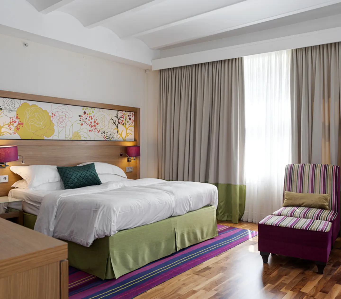 Hotel room with double bed and wardrobe