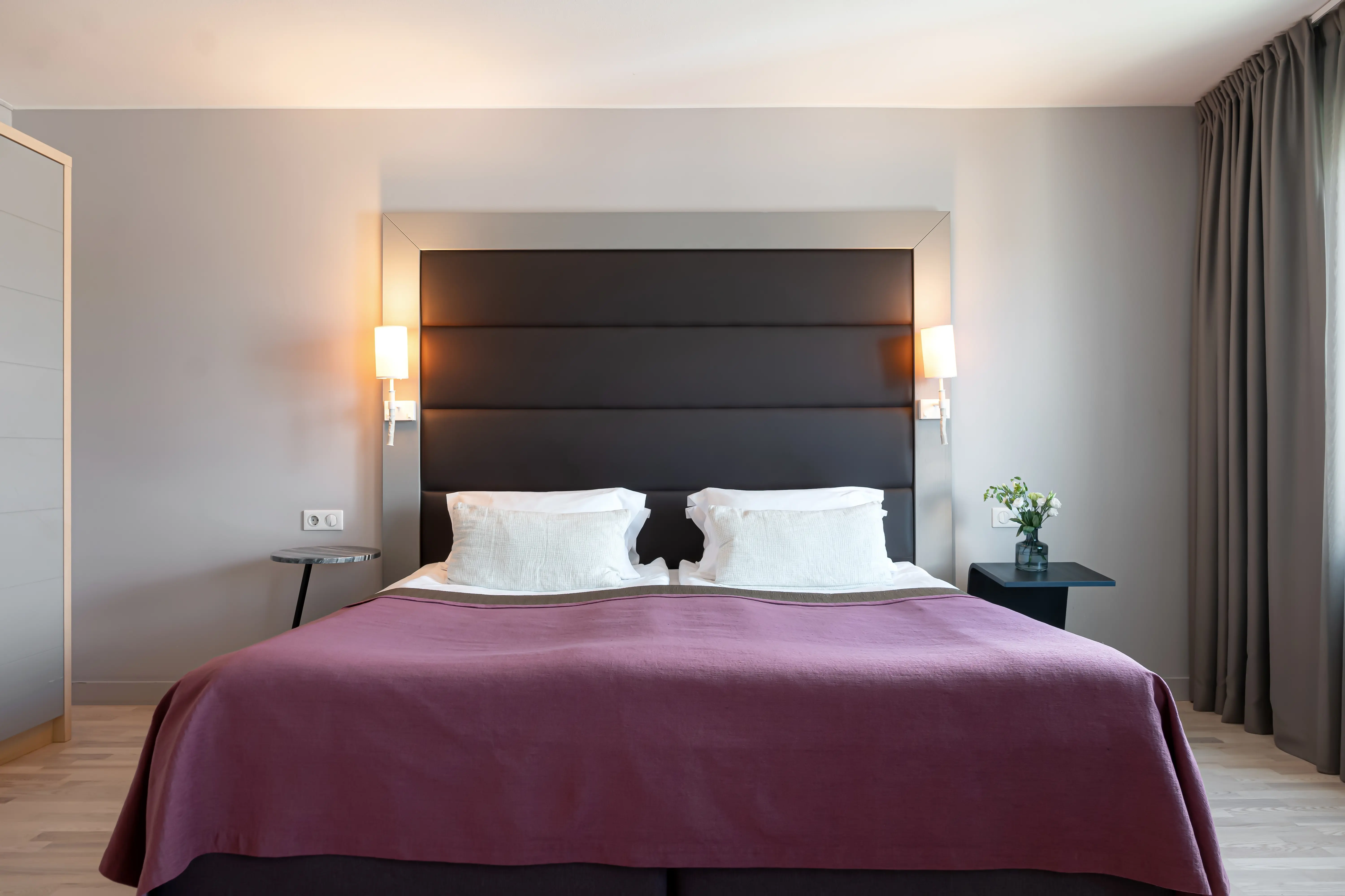 Bright hotel room with large double bed
