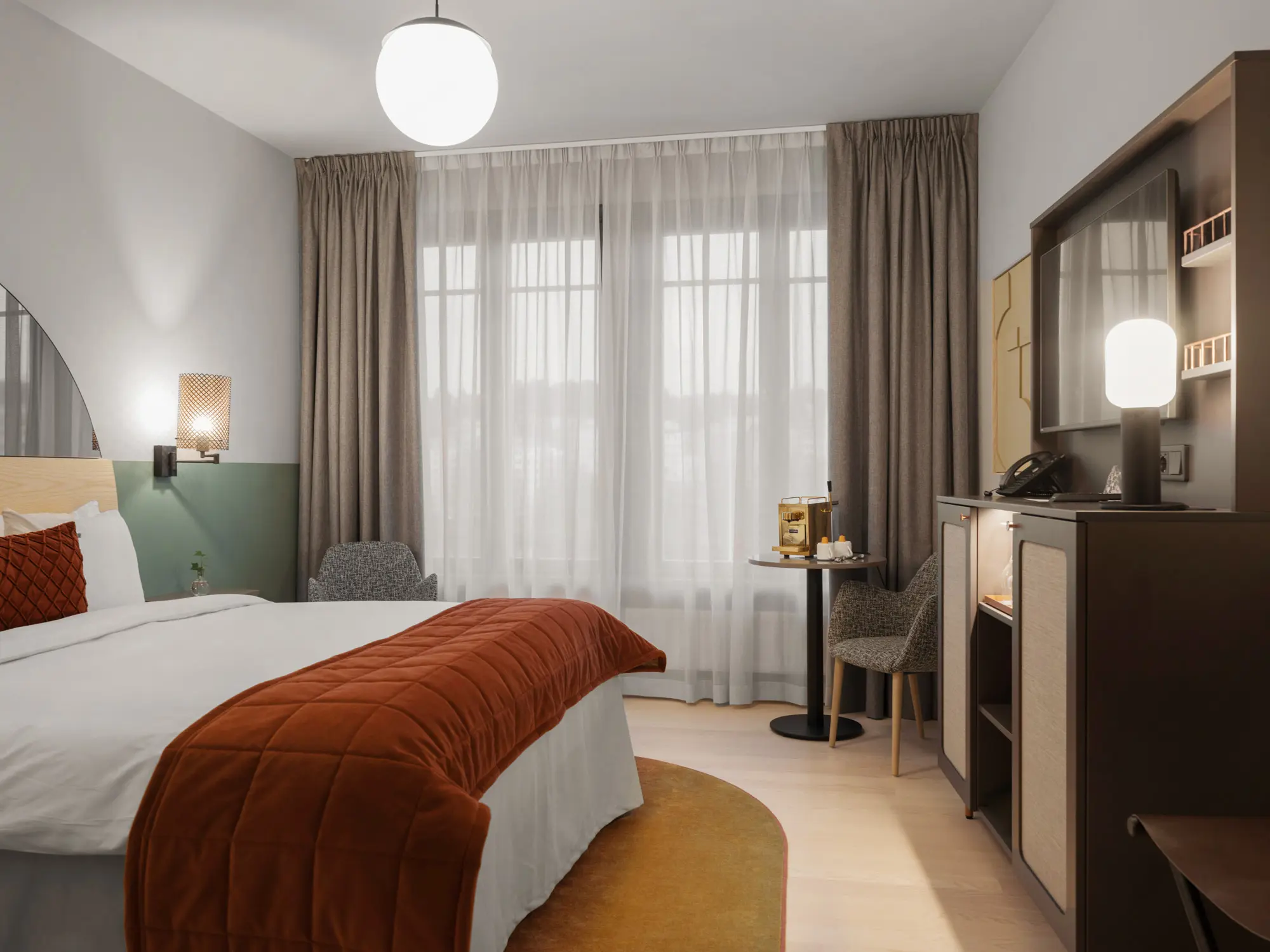 Cozy hotel room with bed, armchair and large window