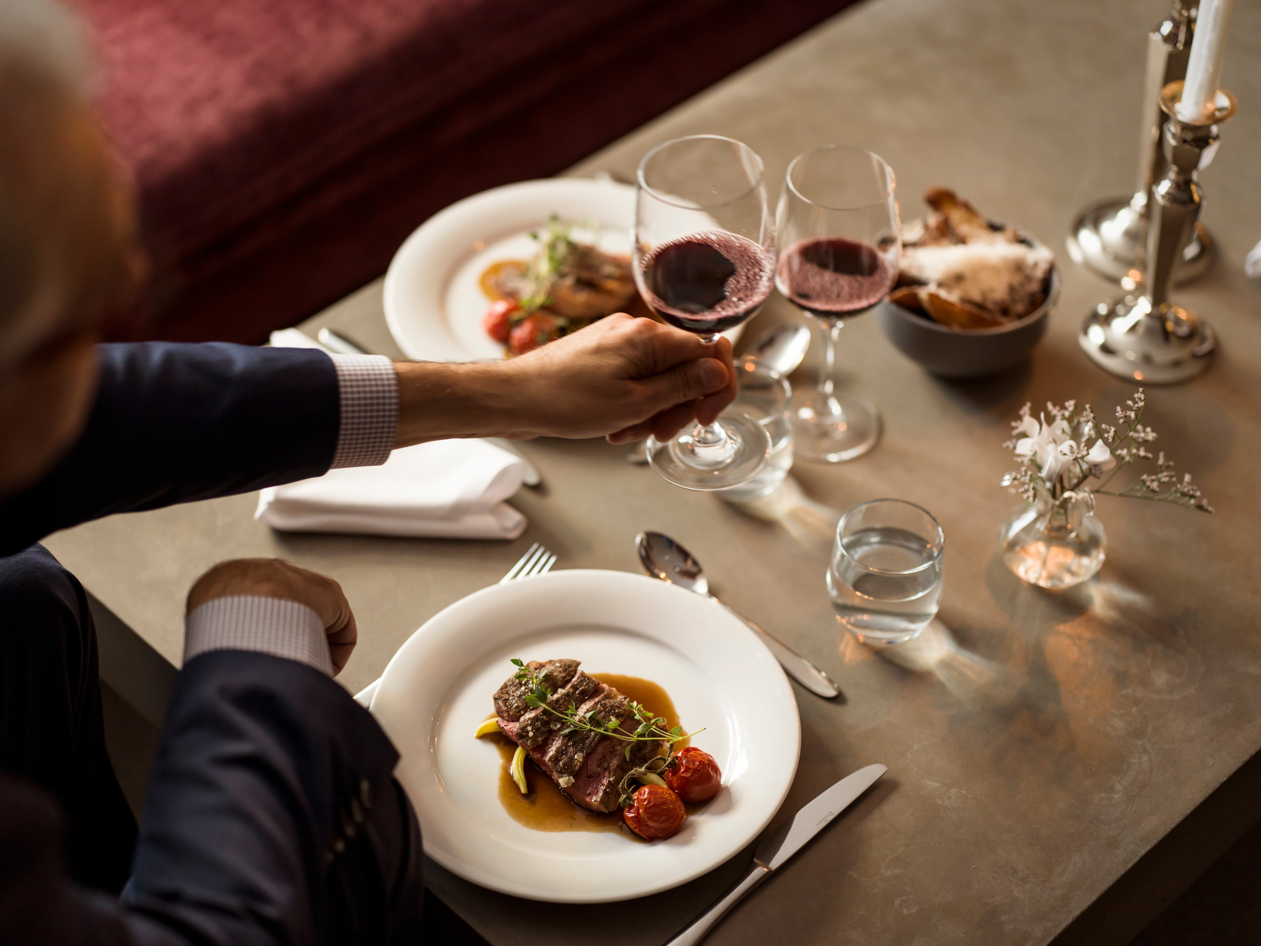 Dinner table with food and wine